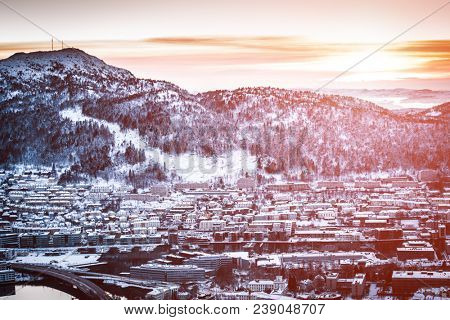 Panoramic view from the mountains to Bergen in winter, ccity in the haze, Norway