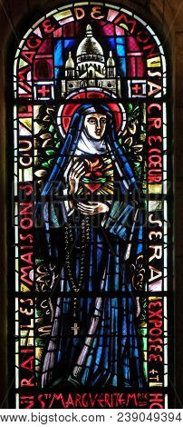 PARIS, FRANCE - JANUARY 08: Saint Margaret Mary Alacoque, stained glass window in Basilica of the Sacre Coeur, dedicated to the Sacred Heart of Jesus in Paris, France on January 08, 2018.