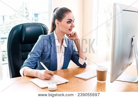 Woman Graphic Designer Working With Computer And Drawing On Graphic Tablet At The Office.graphic Des