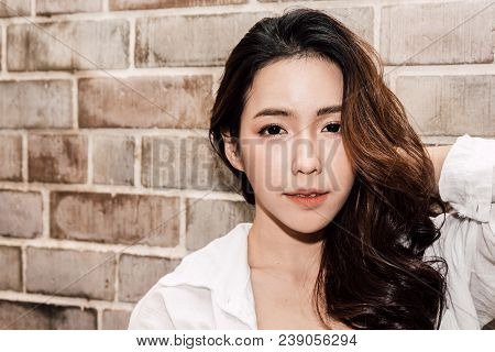 Portrait Of Fashion Smilling Young Beautiful Woman Model Posing In Studio