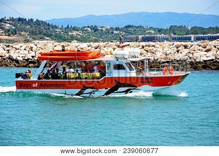 Lagos, Portugal - June 9, 2017 - Tourists Aboard A Dolphin Sightseeing Tour Boat Along The River Ben