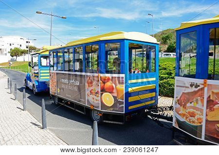 Albufeira, Portugal - June 10, 2017 - Tourist Land Train Along Av. Infante Dom Henrique, Albufeira, 
