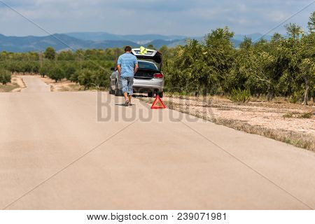 The Car Broke Down On The Road. Emergency Sign Close-up On The Road, Tarragona, Catalunya, Spain