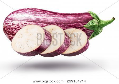 Aubergine or eggplant with aubergine slices on white background. File contains clipping path.