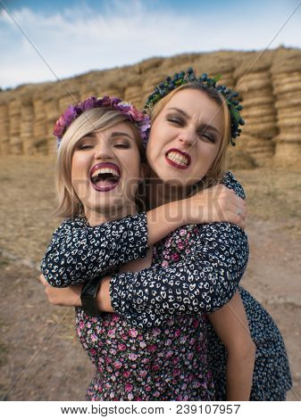 Couple Of Young Sexy Lesbian Girls Laught In Light Dresses Flirt, Play, Pet And Laught In The Pastur