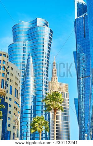 Details Of Modern Glass Skyscrapers Of Al Dafna District With Palm Trees On The Foreground, West Bay