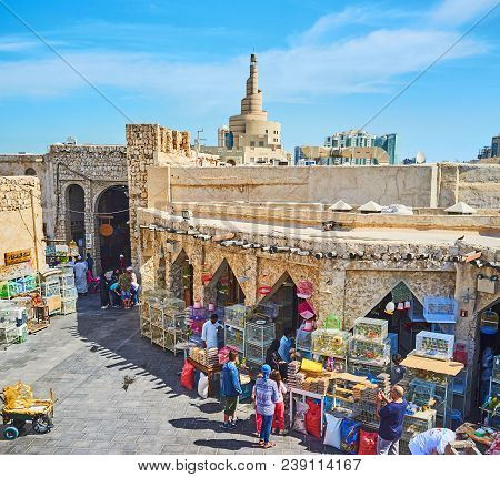 Doha, Qatar - February 13, 2018: The Trade Square Of Birds Market In Souq Waqif With Long Stone Arca