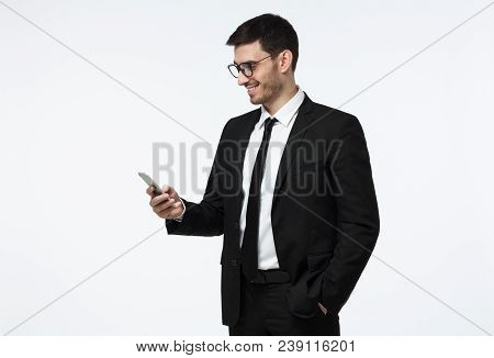Half-length Photo Of Young Handsome European Businessman In Black Suit In Big Glasses Pictured Isola