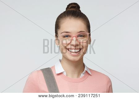 Horizontal Headshot Of Young European Caucasian Female Isolated On Gray Background Dressed In Pink C