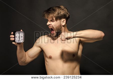 Morning, Wake Up Concept. Man With Alarm Clock Yawn On Red Background. Time, Routine, Deadline. Slee