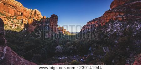 Stunning Panorama Of Fay Canyon From Above The Treetops With Patches Of Snow On The Ground And Majes