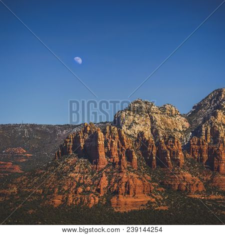 Elevated View Of Colorful Munds Mountain With The Moon In The Sky, Sedona, Arizona