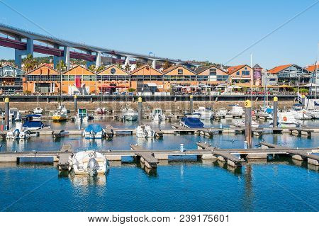 Lisbon, Portugal - Nov 26, 2013 : Santo Amaro Docks With 24th April Bridge In The Background In Dayl