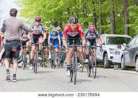 Vielsalm- Belgium, April 22, 2018: Cyclists Compete Riding Rapid And Pass The Nature Forest In Sunny