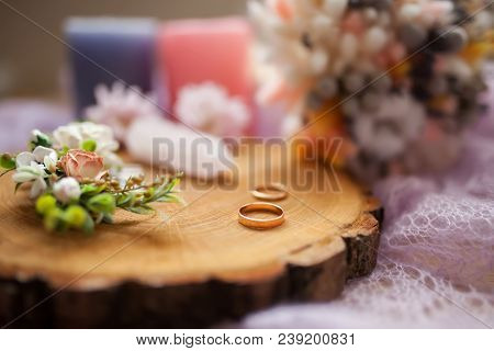 Rusic Style Wedding, Natural Decorations. Wood, Flowers And Wedding Rings