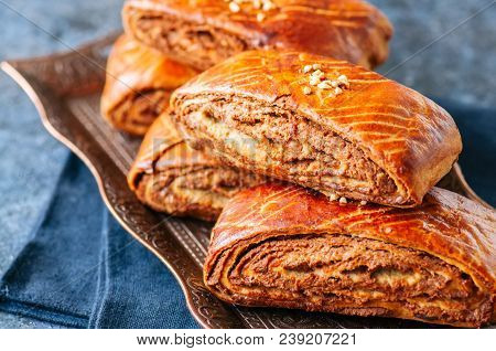 Traditional Turkish Pastry Roll With Chocolate And Nuts Filling - Pastich Served On A Vintage Tray.