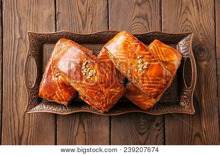 Traditional Turkish Pastry Roll With Chocolate And Nuts Filling - Pastich Served On A Vintage Tray A