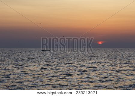 Fishing Boat Sailing At Sunset In Croatia, Adriatic Sea
