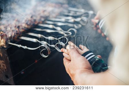Child Hands With Grandfather Cooking Shashlyk Outdoor