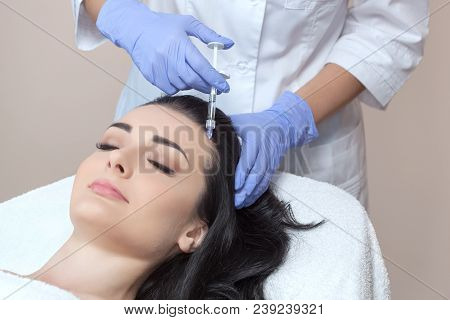 Procedure Of Mesotherapy. The Doctor Cosmetologist Makes The Procedure Of Mesotherapy In Woman's Hea