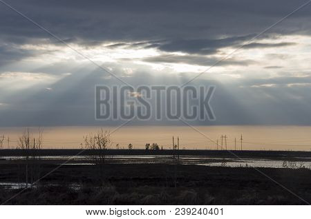 Late At Night. Sundown And Sunrises. River Running Across The Field With Reflections In The Water. E