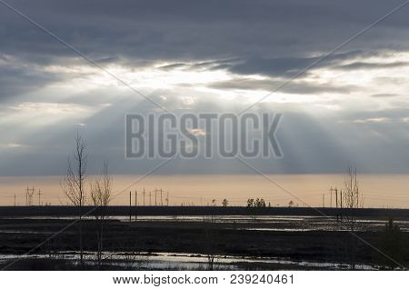 Late At Night. Sundown And Sunrises. River Running Across The Field With Reflections In The Water. E