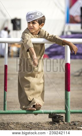 Ibri, Oman, 28th April 2018: Omani Kid At The Races With His Dad