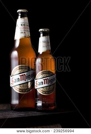 London, Uk - May 03, 2018: Glass Bottles Of San Miguel Lager Beer On Top Of Wooden Background And Bl