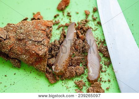 Cuts Of Pepper Basturma On Green Background