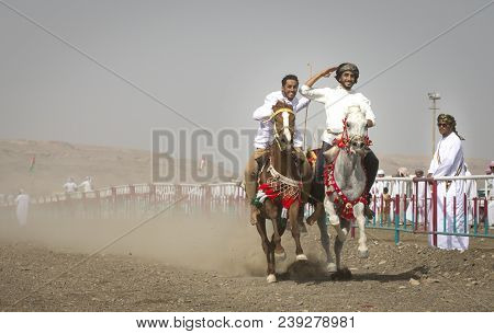 Ibri, Oman, 28th April 2018: Omani Men At A Traditional Horse Race Event Where Young Riders Show The
