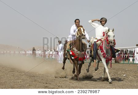 Ibri, Oman, 28th April 2018: Omani Men At A Traditional Horse Race Event Where Young Riders Show The