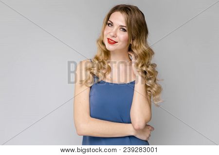 Beautiful Curly Hair. Smiling Girl With Healthy Wavy Long Blonde Hair. Portrait Happy Woman With Bea