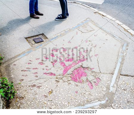 Markings on the streets of Sarajevo indicating where mortar shells exploded during Bosnian war in 1990s