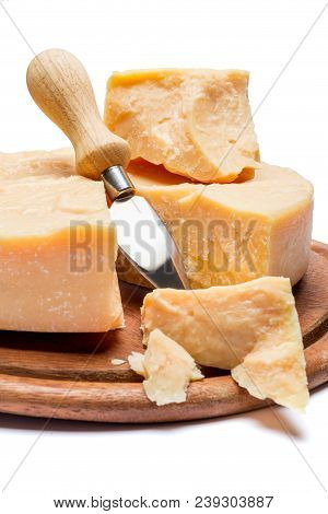 Whole Round Head And Pieces Of Parmesan Or Parmigiano Hard Cheese