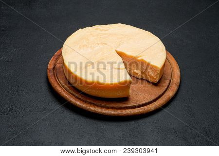 Whole Round Head And Pieces Of Parmesan Or Parmigiano Hard Cheese