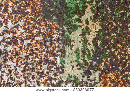 Corroded Peel Paint Metal Surface Background With Spots Of Rust, White And Green Paint