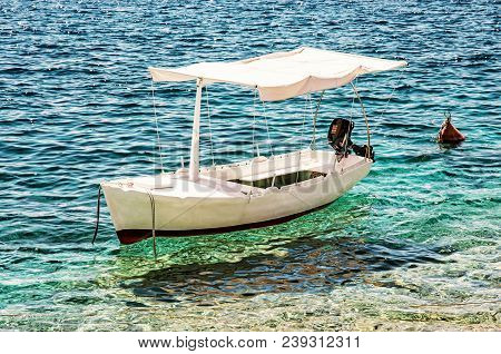 Anchored Little Boat In Maslinica, Solta Island, Croatia. Summer Vacation Destination. Beauty Photo 