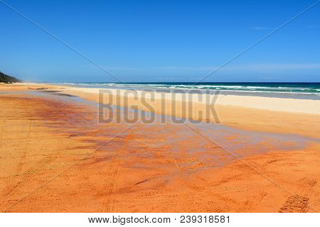 40-mile Beach In Great Sandy National Park In Queensland, Australia, With Tyre Tracks.