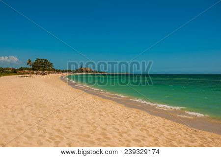 The Beautiful Beach Of Playa Ancon Near Trinidad, Cuba. Landscape With Yellow Sand And Turquoise Sea