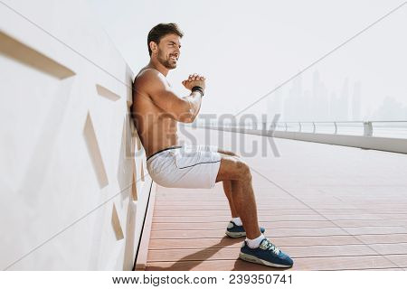 Beautiful Man Doing Work Out And Different Exercises Outdoor