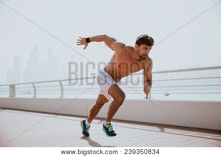 Beautiful Man Doing Work Out And Different Exercises Outdoor