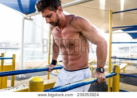 Beautiful Man Doing Work Out And Different Exercises Outdoor