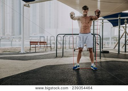 Beautiful Man Doing Work Out And Different Exercises Outdoor