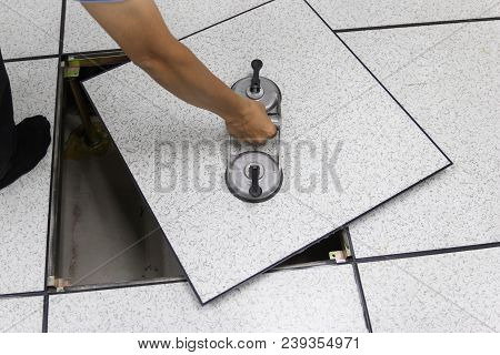 Suction Lifter - Hand Man On Tool Platform - The Open Floor In Server Room Raised Floor Tile Lifter
