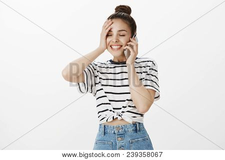 Girl Feeling Relieved After Someone Found Her Lost Wallet. Pleased Happy Good-looking Woman With Bun