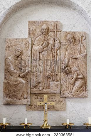 MUNSTERSCHWARZACH, GERMANY - JULY 09, 2017: Saints Anselm of Canterbury, the bishops Liudger and Ansgar, missionary in Scandinavia, altar in Munsterschwarzach Abbey, Benedictine monastery, Germany.