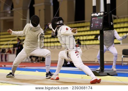 ST. PETERSBURG, RUSSIA - MAY 4, 2018: Chen Li, China vs Hans Joachim Lecocq, Belgium in first competition day of Fencing World Cup Saint-Petersburg Foil. This annual tournament is hold in 44th time
