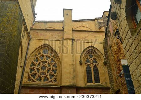 Masterly Cathedral With Its Abovered Windows In The Fortified Town Of Getaria. Architecture Middle A