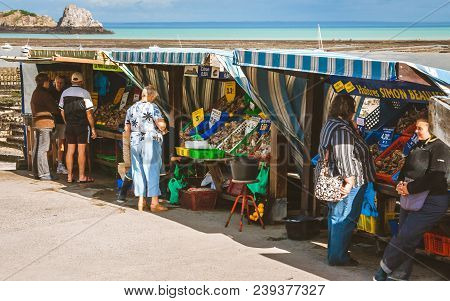 Cancale, France - October 6, 2009: Tourists And Locals Buying Oysters At Small Market In Cancale Nea