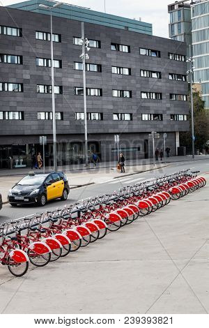 Barcelona, Spain. March 22, 2015: Bicycles For Hire, Red Anche Black And White With Red Covers. Barc